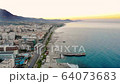 Aerial drone footage, morning in the city by the sea 64073683