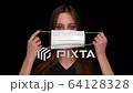 funny Woman not correctly Puts on Medical Mask 64128328