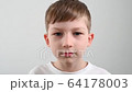 virus and flu protection concept, boy takes off the mask and rejoices 64178003