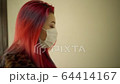 Beautiful young asian girl in medical mask clothing walk gloomy dark corridor 64414167
