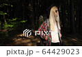Charming young woman with a magnificent golden hair, black sunglasses, Attractive young lady is chilling on the nature, she walk throught forest with camping backpack. Camping, Travel, Nature, Forest 64429023