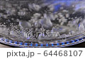 Water boiling water at bottom of kettle. Close-up backlit kettle 64468107