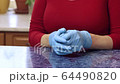 Woman is taking off disposable hygiene gloves 64490820