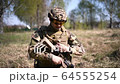 Tired warrior or military soldier dressed in 64555254