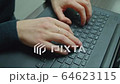 Women's hands typing on computer keyboard 64623115
