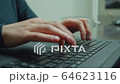 Women's hands typing on computer keyboard 64623116