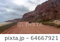 Alagoas, Brazil - mar 9 2020: Tourists by the cliffs bordering the sea near Gunga beach in Alagoas, Brazil 64667921