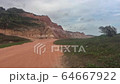 Alagoas, Brazil - mar 9 2020: Beautiful relief with cliffs bordering the sea near Gunga beach in Alagoas, Brazil 64667922