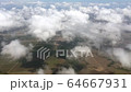 Flying over the farms in Alagoas state, Brazil, with clouds all over. 64667931