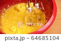 Preparation of sweet cream in bowl with mixer 4K 64685104