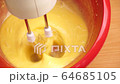 Preparation of sweet cream in bowl with mixer 4K 64685105