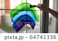Little boy drawing on window rainbow while coronavirus quarantine. Rainbow sign is symbol of hope, means that everything will be OK. Stay home for lockdown coronavirus. 64741336