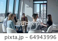 Confident caucasian woman brunette HR manager tells new employees 64943996
