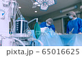 ventilator during an operation, FullHD shot. The movement is remembered by artificial lung ventilation, amid a ward with a patient and doctorsCovid 19 65016625