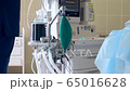 Close-up of a ventilator during an operation, FullHD shot. The movement is remembered by artificial lung ventilation, amid a ward with a patient and doctors. Pneumonia and tuberculosis, Covid 19 65016628