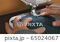 Women's hands sewing fabric with a sewing machine / sewing with a sewing machine / hobbies 65024067
