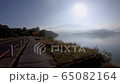 Young woman riding bicycle on Sun Moon lake bike trail, Travel lifestyle concept 65082164