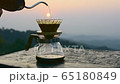 Making driping coffee on the mountain. 65180849
