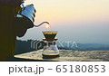 Making driping coffee on the mountain. 65180853