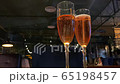 A glass of cold champagne close-up against a dark background 65198457