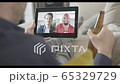 Male Friends having video call with drinks from home using video conferencing technology during social distancing lock down during covid-19 65329729