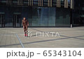 The concept of learning to skateboard a young man. The guy fell off the longbod while riding straight 65343104