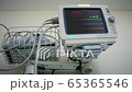 Cinemagraph of a medical monitor inside a patient room at a hospital 65365546