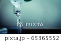 Cinemagraph of a fluid intravenous saline drip in a hospital room 65365552