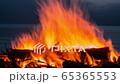Cinemagraph of a campfire at twilight on the beach 65365553