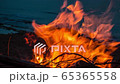 Cinemagraph of a campfire at twilight on the beach 65365558