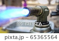 Cinemagraph of a bursting blue fire from a manual gas burner 65365564