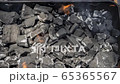Cinemagraph of a burning fire on burnt coal in a BBQ grill 65365567