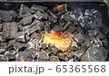 Cinemagraph of a burning fire on burnt coal in a BBQ grill 65365568
