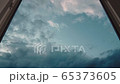 Beautiful clouds fly fast outside the window 65373605
