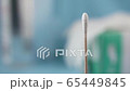 Panning shot of swab for coronavirus testing. 65449845