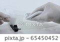 Removing droplets from a coronavirus face shield for use in ER. 65450452