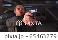 The stern man takes out a gun. Medium Close up 65463279