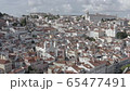 Aerial panoramic view of Alfama neighborhood in Lisbon on sunny afternoon from a viewpoint 65477491