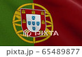 Portuguese Republic Flag known as "Bandeira de Portugal" or "Bandeira das Quinas" waving in the Wind. Detailed shot.  65489877