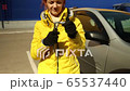 Woman shows how to attach the parts of a wrench to each other 65537440