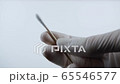 Spinning a swab for coronavirus testing. Closeup in FullHD 65546577