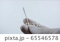 Close up of swab for covid-19 testing. Doctor with white surgical gloves 65546578