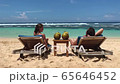 Couple on beach at tropical resort 65646452