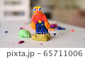 Plasticine man made by a preschooler child. Playing dough at home during coronavirus quarantine.  65711006