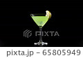 Green cocktail. Ice cubes are floating and rotates in the green summer cocktail with lime slice on the edge of the glass on the black table against black background. Concept of alcohol cocktail party 65805949
