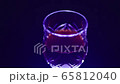 Glass of red wine on a black background 65812040