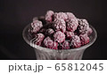 Raspberry berries in a glass on a black background 65812045