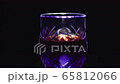 Glass of red wine on a black background 65812066