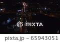 4K Aerial. Up over Night City  cars traffic highway with fires 65943051