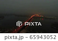 4K Aerial. Night City highway with car traffic and  bridge over river 65943052